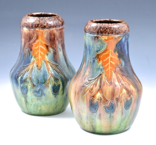 A pair of Belgian pottery Art Nouveau vases, circa 1900, incised with leaf and fruit design under