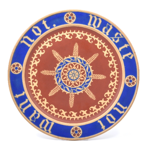 A.W.N. Pugin for Minton, an encaustic bread plate, circa 1860, the central field with radiating ears