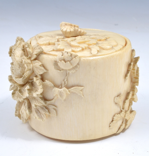 A Chinese carved ivory box, probably Guangxu, floral decoration, carved in high relief, 9cms.