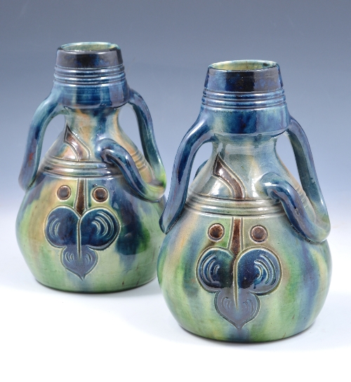 A pair of Belgian pottery Art Nouveau vases, circa 1900, each with sinuous twin-handles, incised