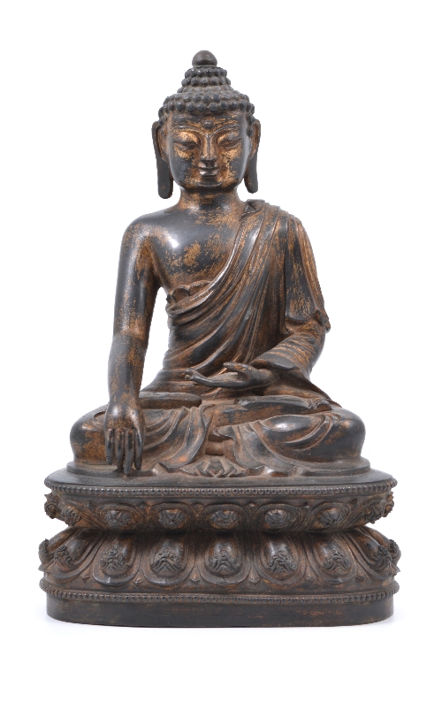 A Tibetan style bronze figure of Buddha seated in padmasana, on a lotus throne with hands in
