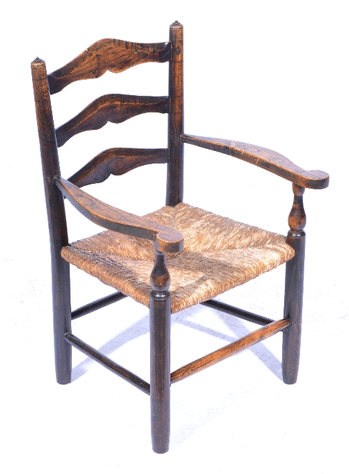 A rare, early 'Russell' child's armchair, designed by Ernest Gimson, probably executed by Edward