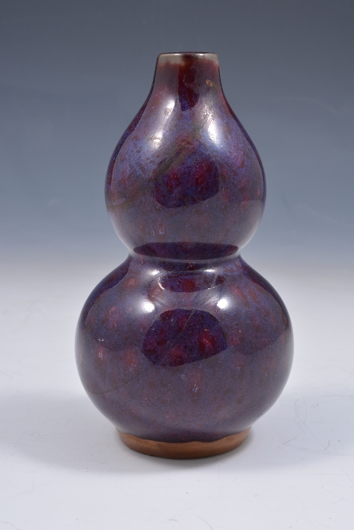 Chinese flambé glazed double gourd-shaped vase, 15cms.