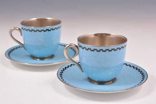 Two Royal Worcester cabinet cups and saucers, date mark for 1934, powder blue with silver coloured