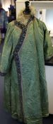 A Chinese green satin brocade and fur lined coat, late 19th / early 20th century, the exterior