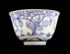 A Chinese blue and white `bamboo and fruits` cup, Chenghua seal mark, Kangxi period, painted with