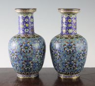 A pair of Chinese cloisonne enamel bottle vases, 19th century, each decorated with lotus flowers and