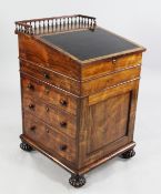 An early 19th century rosewood davenport, in the manner of Gillows, the hinged top with leather