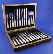A cased set of twelve pairs of late Victorian mother of pearl handled silver dessert eaters, in