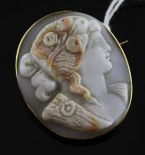 An 18ct gold mounted oval cameo brooch, carved with the head of a lady to sinister, 1.5in.