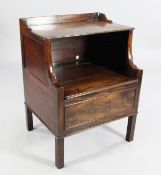 A 19th century mahogany bedside cabinet, with hinged top, on square section legs, W.1ft 11.5in.