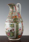 A Chinese Canton decorated famille rose pear shaped ewer, 19th century, typically painted with