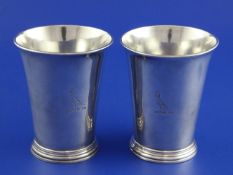 A pair of early George III silver beakers by Thomas Whipham & Charles Wright, with flared rim and