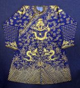 A Chinese blue satin and metal thread `dragon` robe, late 19th / early 20th century, with single