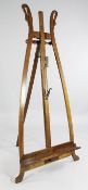 A Biedermeier fruitwood easel, of A frame form with swan`s neck terminals, H.5ft 8in.