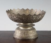 A Malaysian silver pedestal bowl, early 20th century, with petal lobed rim cast and chased in low