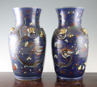 A pair of Chinese enamelled porcelain vases, late 19th / early 20th century, unusually enamelled