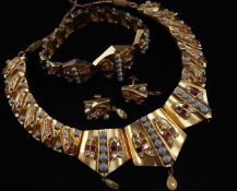 A Middle Eastern high carat gold and gem set parure, comprising necklet, bracelet and pair of