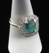 An 18ct gold, emerald and diamond octagonal cluster ring, size O.