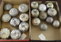 A collection of nineteen Malaysian and Indonesian silver and white metal lime and betelnut boxes,