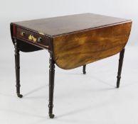 A George III mahogany Pembroke table, with single end drawer opposing dummy drawer on ring turned