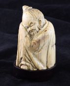 A Chinese ivory seated figure of Li Bai, Kangxi seal mark, early 20th century, with age cracks to