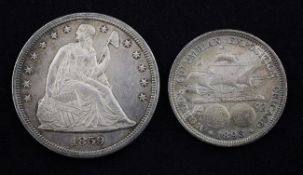A US 1859 silver 1 dollar, EF and a US 1893 Columbian Expo commemorative half dollar, VF/EF