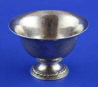 A 1930`s Arts and Crafts silver pedestal bowl by Omar Ramsden, with flared rim, planished body and