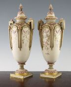 A pair of Royal Worcester blush ivory twin handled vases and covers, c.1867 the ivory ground