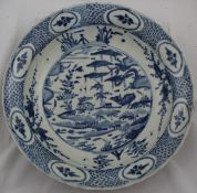 A Chinese Ming blue and white dish, Swatow, early 17th century, painted to the centre with two