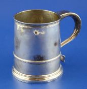 A George I silver mug, with banded girdle and handle with engraved initials, maker`s mark rubbed,