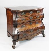 A 19th century Dutch bombe shape walnut marquetry commode, fitted four graduated drawers on lion paw