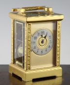 A Richard & Co gilt brass carriage clock, with silvered arabic chapter ring, movement striking on