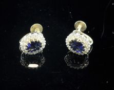 A pair of 9ct gold, sapphire and diamond cluster oval ear clips.