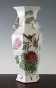 A Chinese famille rose hexagonal baluster vase, Guangxu period, painted with a bird amid pink