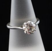 An 18ct white gold and solitaire diamond ring, the round brilliant cut stone weighing