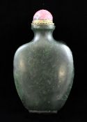 A Chinese spinach green jade snuff bottle, 1800-1900, of spade form with a convex eliptical foot,