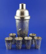 An early 20th century Chinese silver cocktail shaker and six matching tots, the shaker with