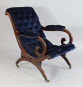 A Victorian mahogany scroll back open armchair, with blue buttoned upholstery, on shaped supports