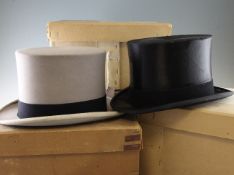 A grey top hat by Locke & Co with original cardboard box, together with three other black top hats