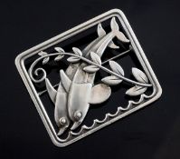 An Arno Malinowsky for Georg Jensen Danish sterling silver twin dolphin brooch, design no. 251, in