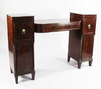 A Regency mahogany pedestal sideboard, the drop centre top with projecting frieze drawer between two