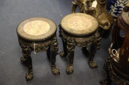 A pair of Chinese rosewood and rouge marble stands, late 19th century, with circular tops above