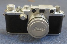 A Leica IIIc no.421141 and accesories the camera with Summicron lens in collapsible mount and