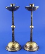 A pair of early 20th century Arts & Crafts WMF plated brass candlesticks, with squared tapered