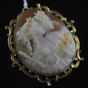 A 15ct gold mounted oval cameo brooch, with scroll border and carved with the busts of two lady`s to