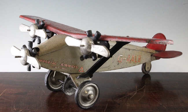 A large Triang steel airliner, with Imperial Airways decals, red wings and grey body, with the