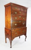 A George III mahogany chest on stand, with an arrangement of six drawers, on cabriole legs, W.3ft