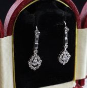 A pair of Art Deco style white gold and diamond drop earrings, set with baguette and round cut