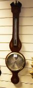 Smith of London. A Regency inlaid mahogany wheel barometer, with silvered thermometer and dial,